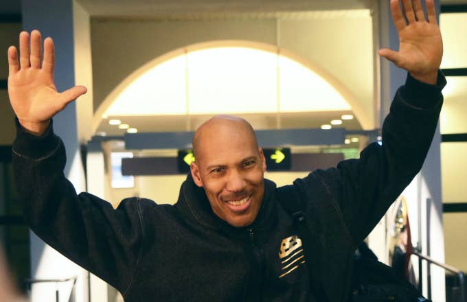 US entrepreneur LaVar Ball waves upon his arrival with his sons at Vilnius airport in Lithuania