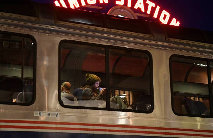 Train passenger Morissa Goodman sips hot coffee on the Amtrak Winter Park Express