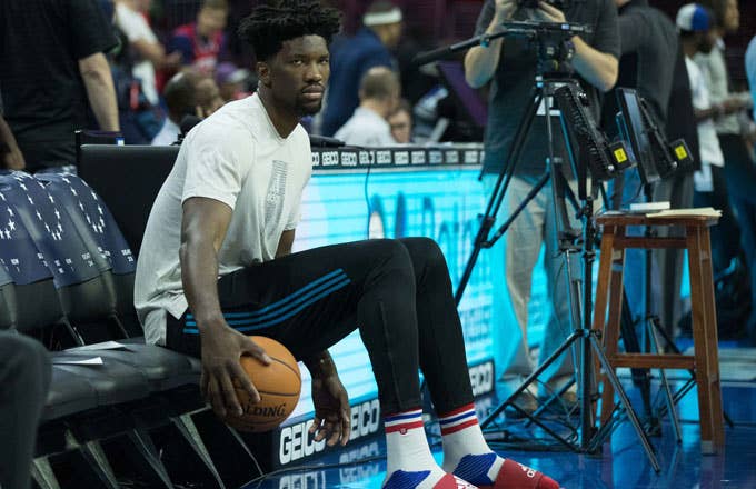 Joel Embiid sits on the bench.