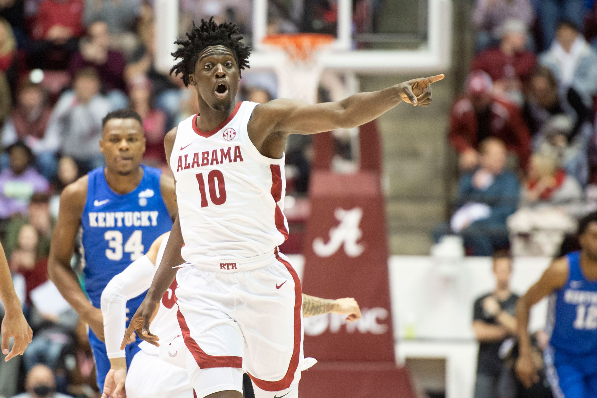 Charles Bediako #10 of the Alabama Crimson Tide reacts after a big play during their game against the Kentucky Wildcats at Coleman Coliseum