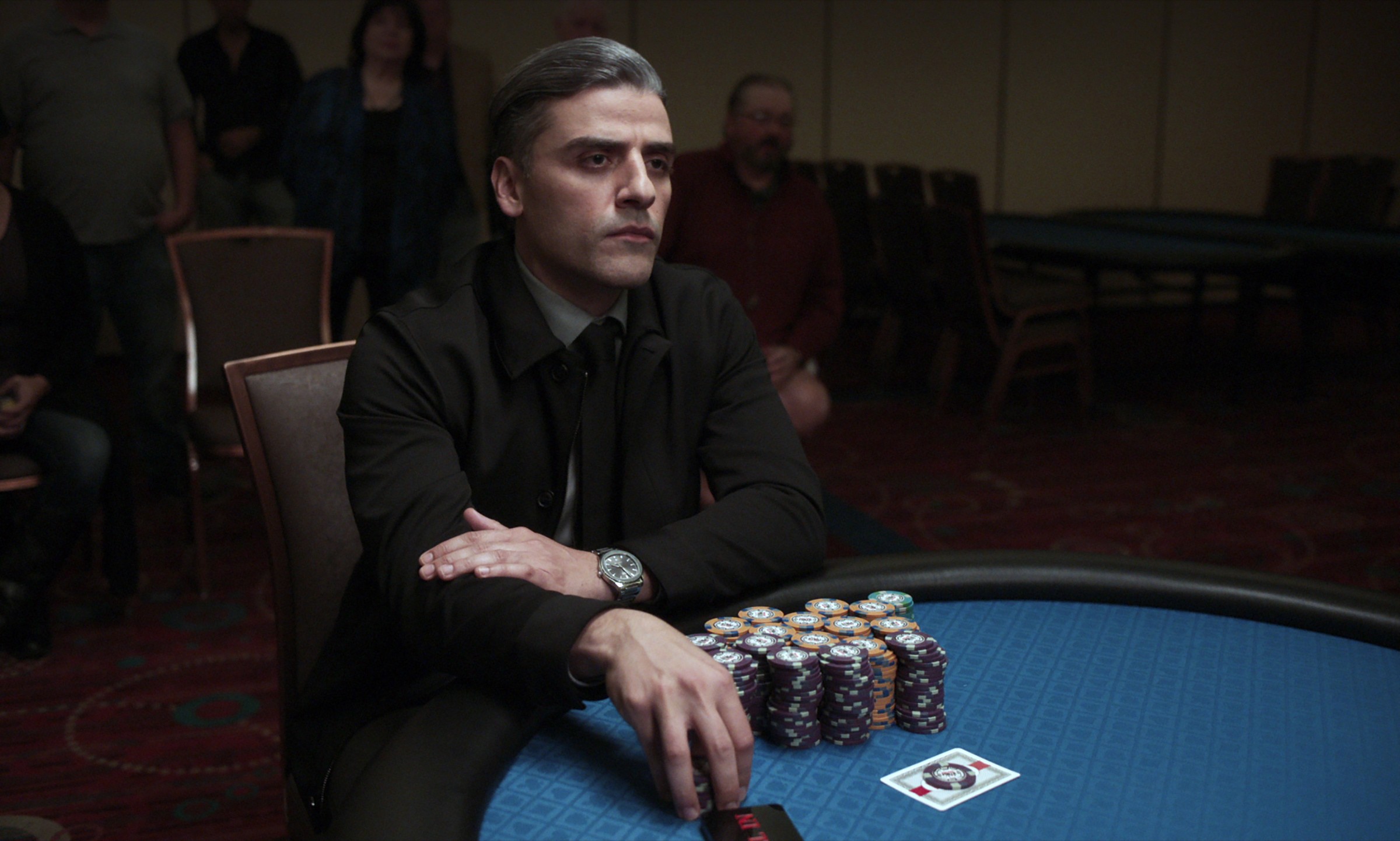 oscar isaac holds chips in the card counter