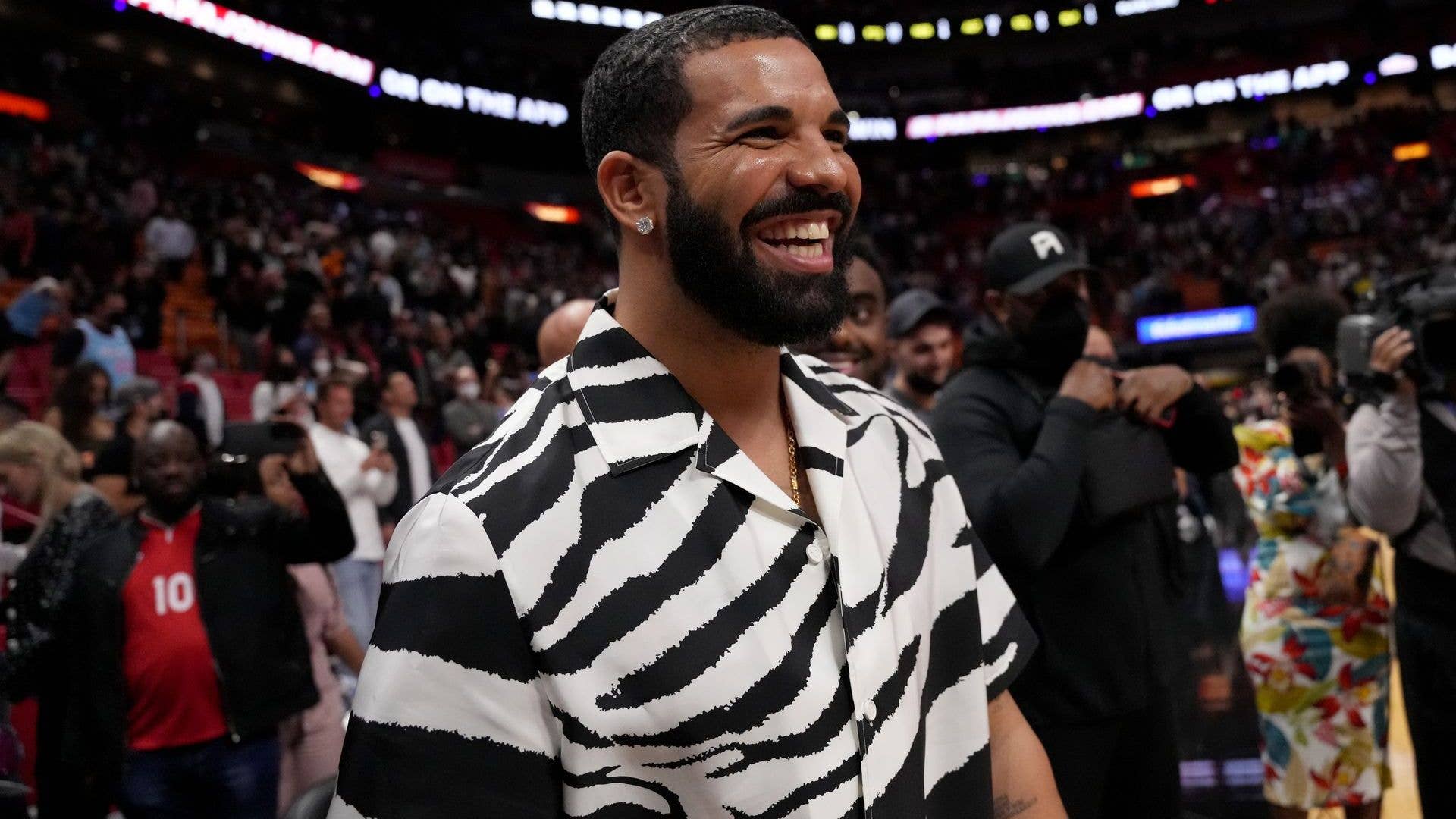 Drake reacts after attending the game between the Miami Heat and the Atlanta Hawks