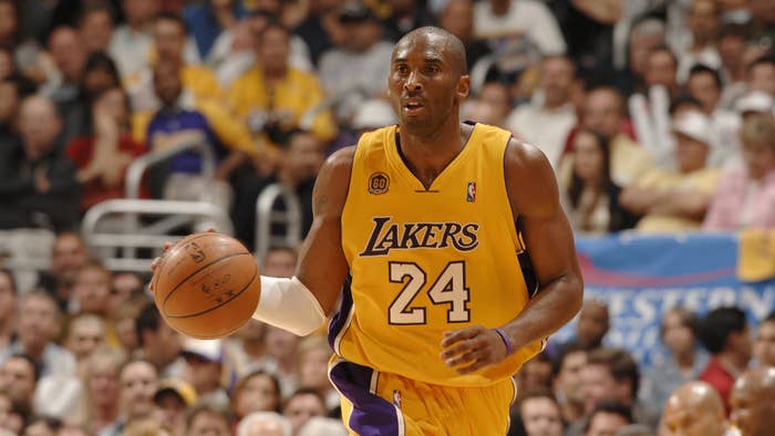 Kobe Bryant #24 of the Los Angeles Lakers brings the ball up the court against the San Antonio Spurs