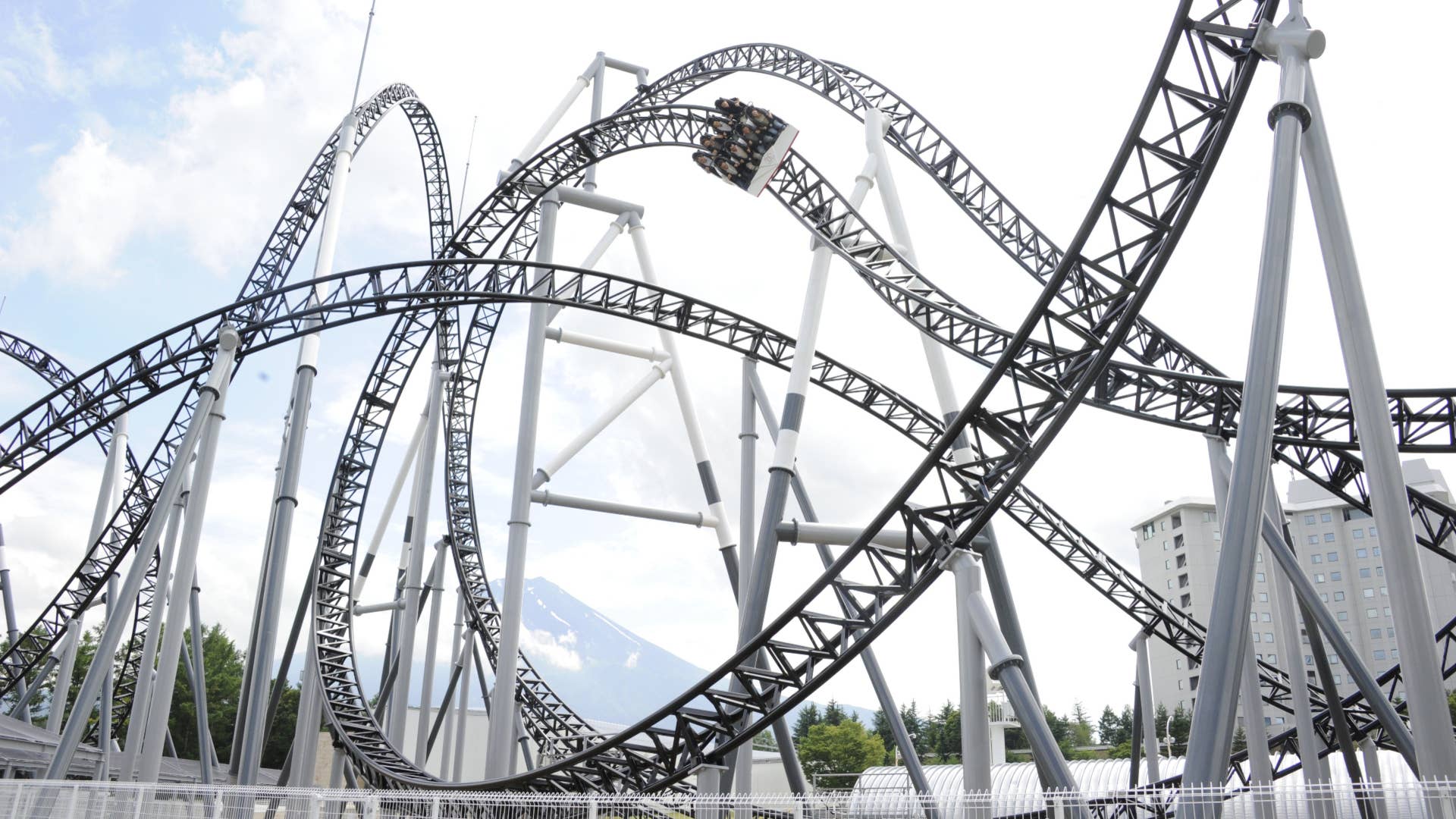 People react as they ride on Fuji-Q Highland amusement park world's steepest roller coaster "Takabisha."
