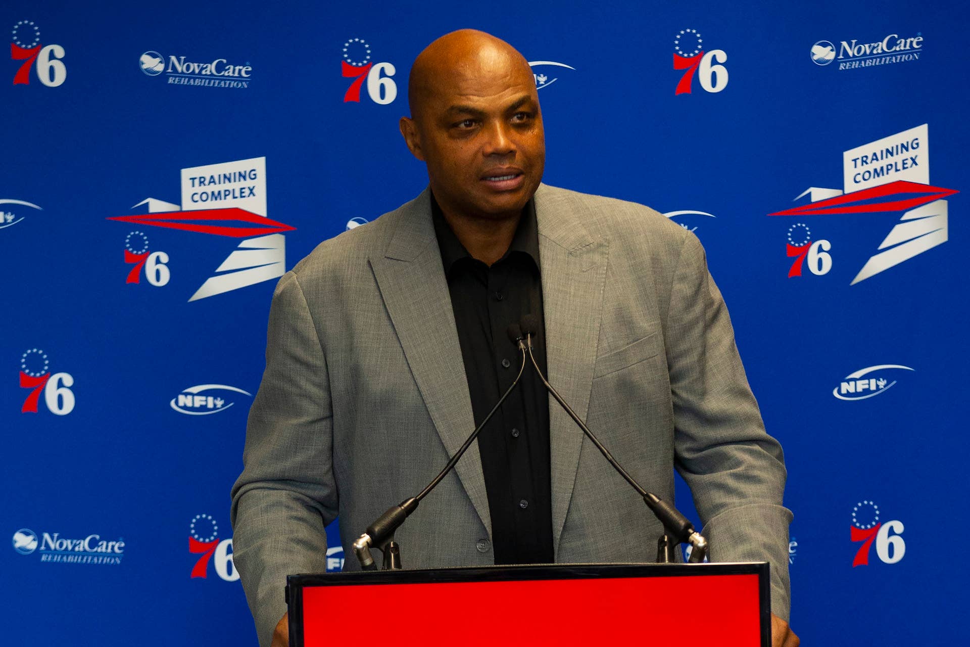 Charles Barkley speaks prior to his sculpture being unveiled at 76ers training facility.