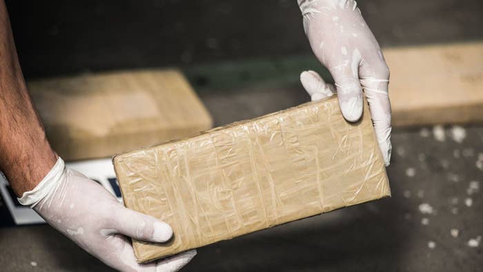 a package of cocaine being held up