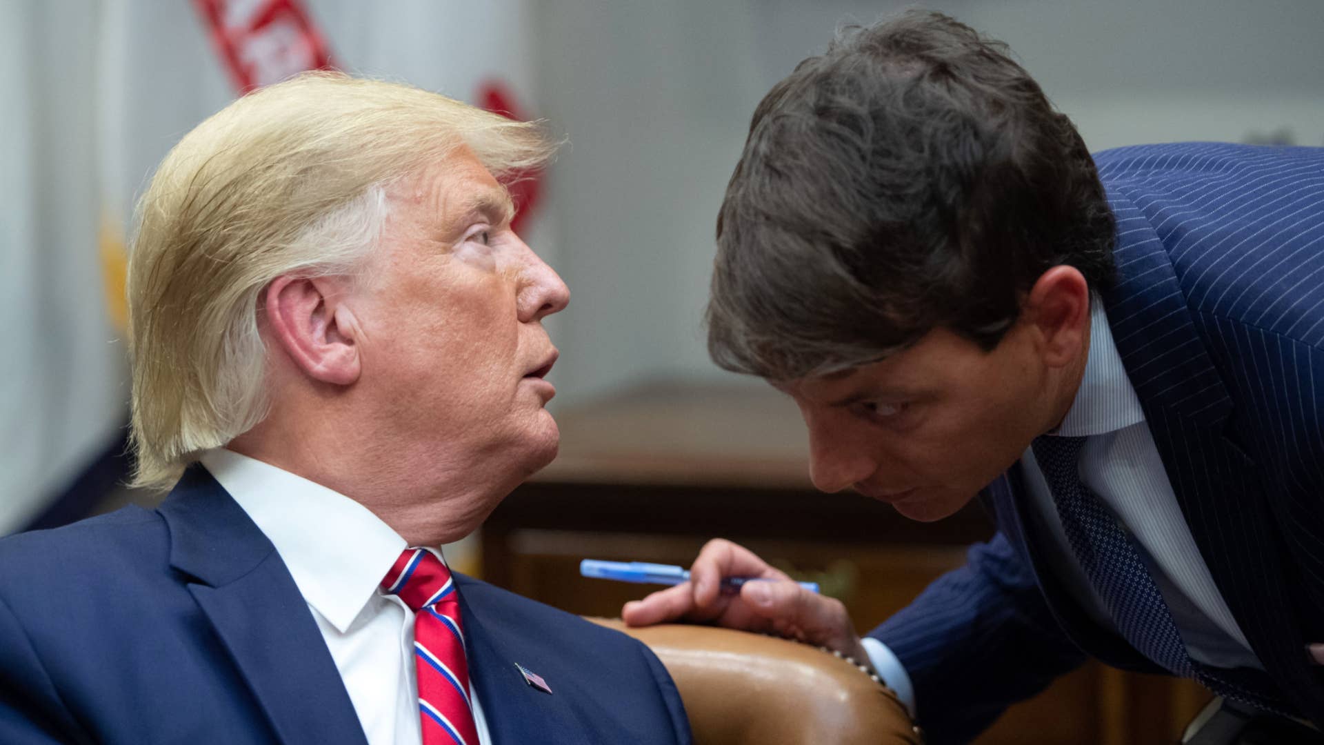 Donald Trump speaks with Hogan Gidley during a meeting on the opioid epidemic.