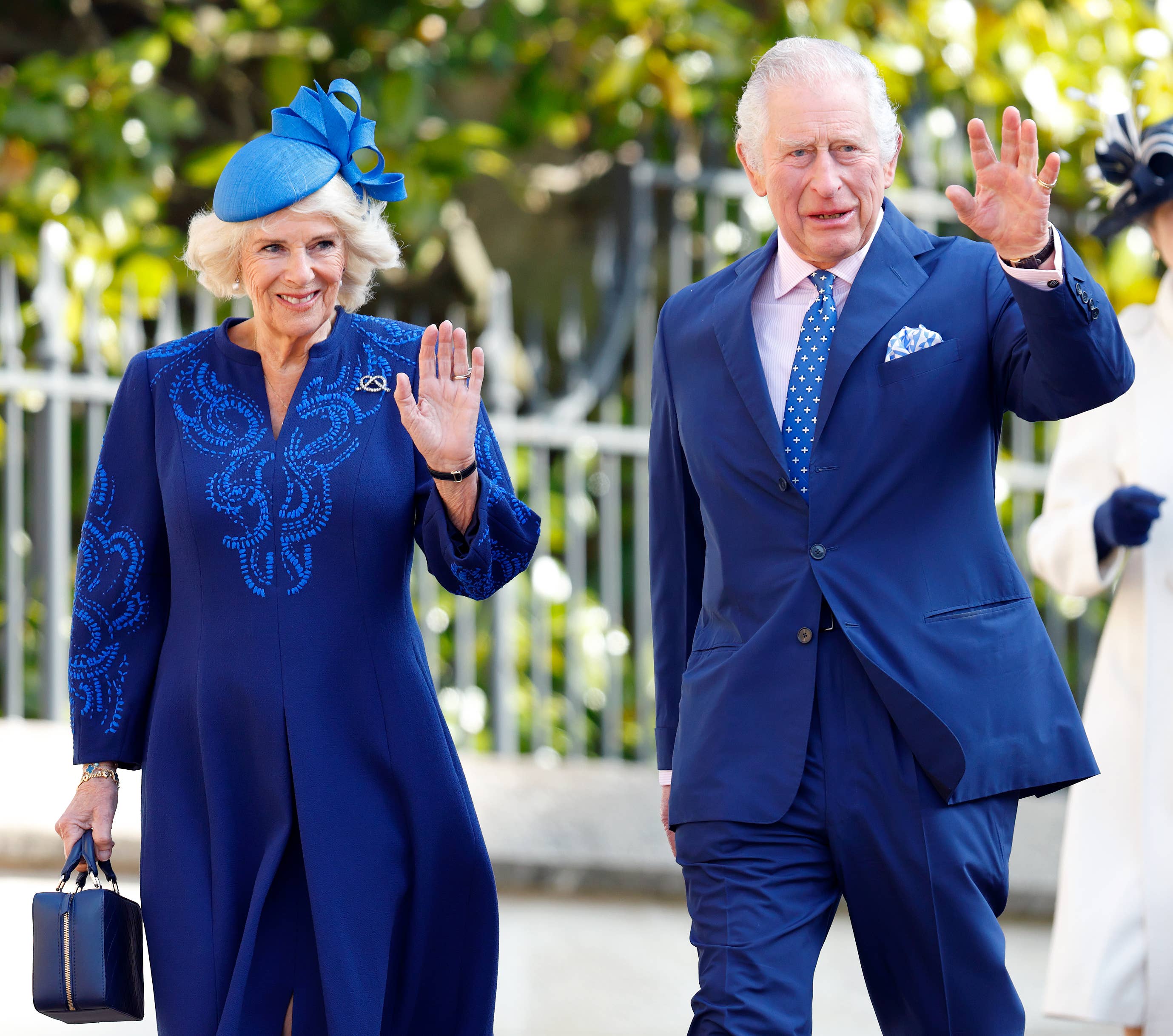 King Charles and Camilla waving