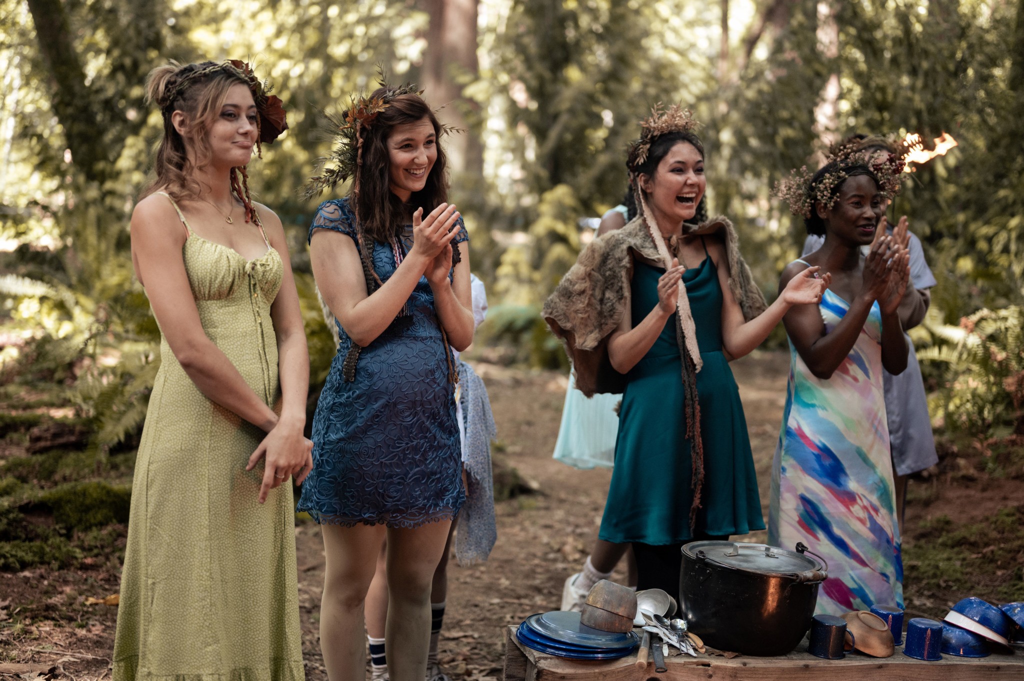 A group of girls clap their hands.