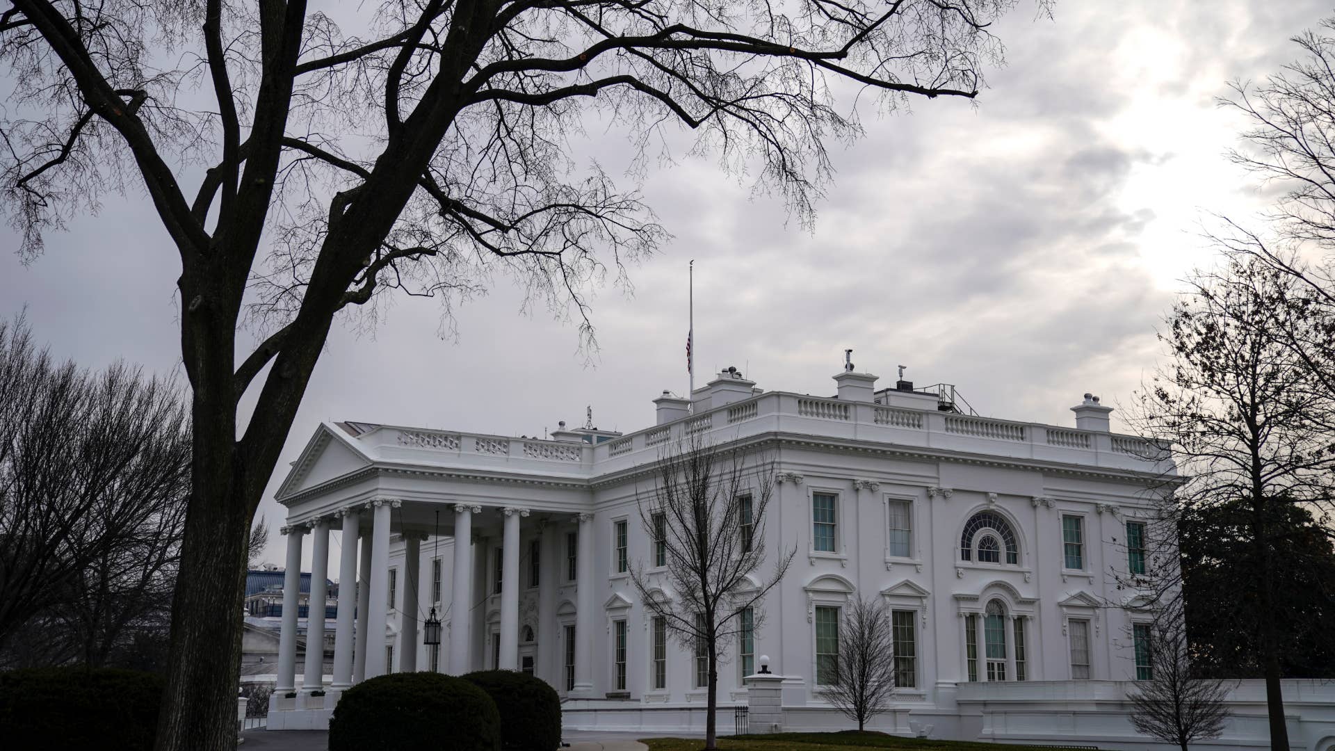 American flag flies at half staff over the White House.
