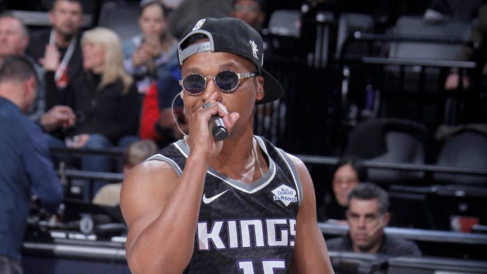 Lupe Fiasco performs during the game
