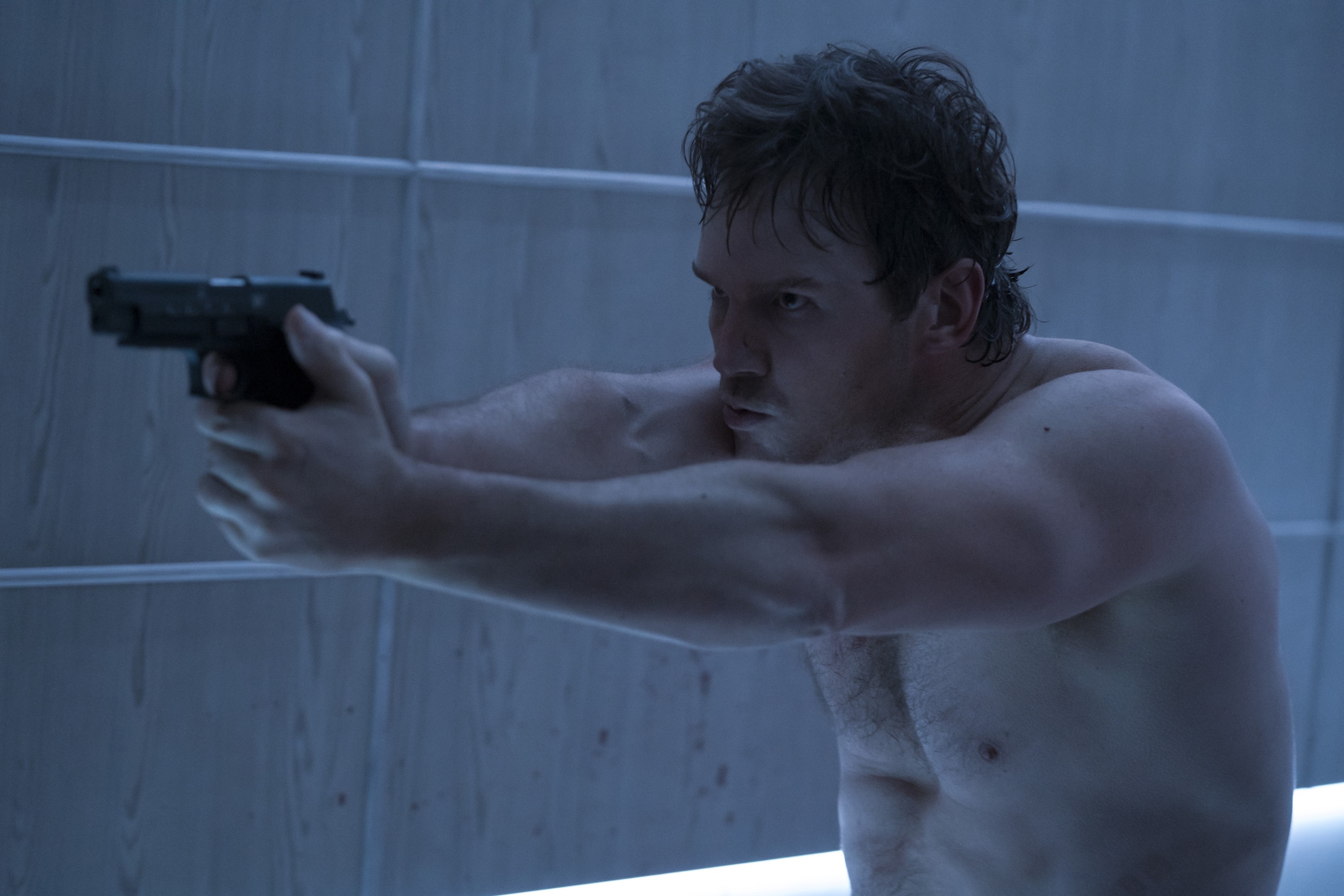 Chris Pratt is shirtless with a gun.