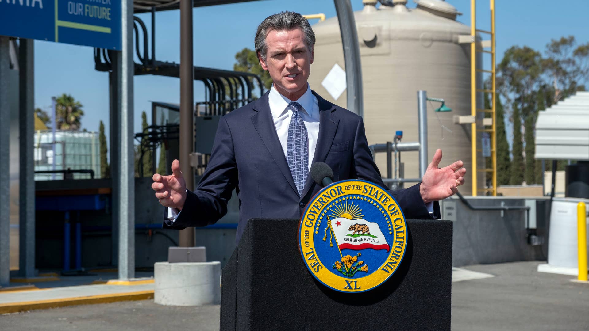 Gavin Newsom is pictured at a podium