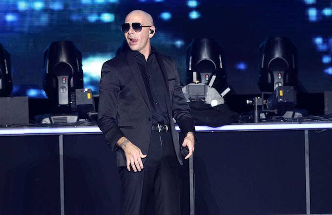 Pitbull performs onstage at The Forum.