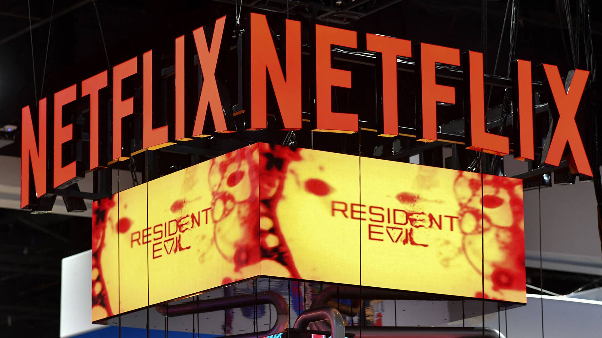 The Netflix booth advertises the "Resident Evil" series on a screen during Comic-Con International in San Diego