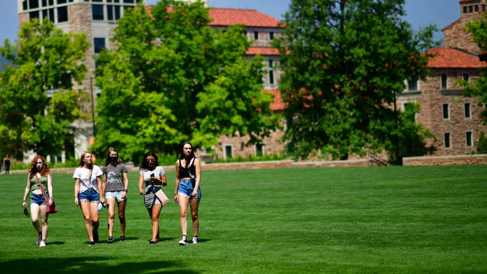 Freshmen walk through campus after moving into dormitories at University of Colorado Boulder