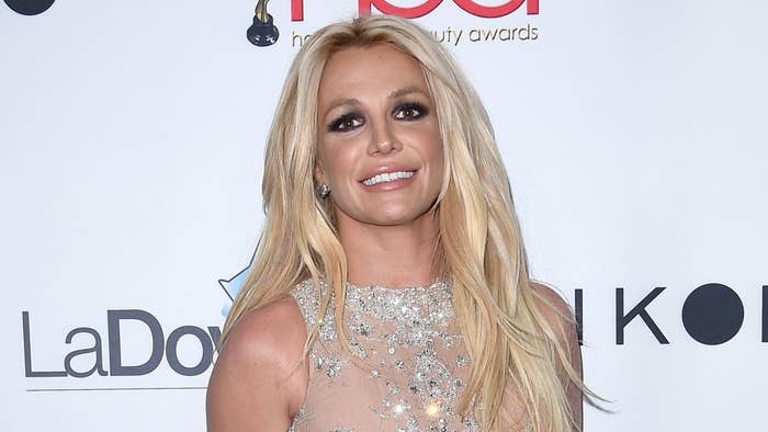 Britney Spears poses for photos at an event.