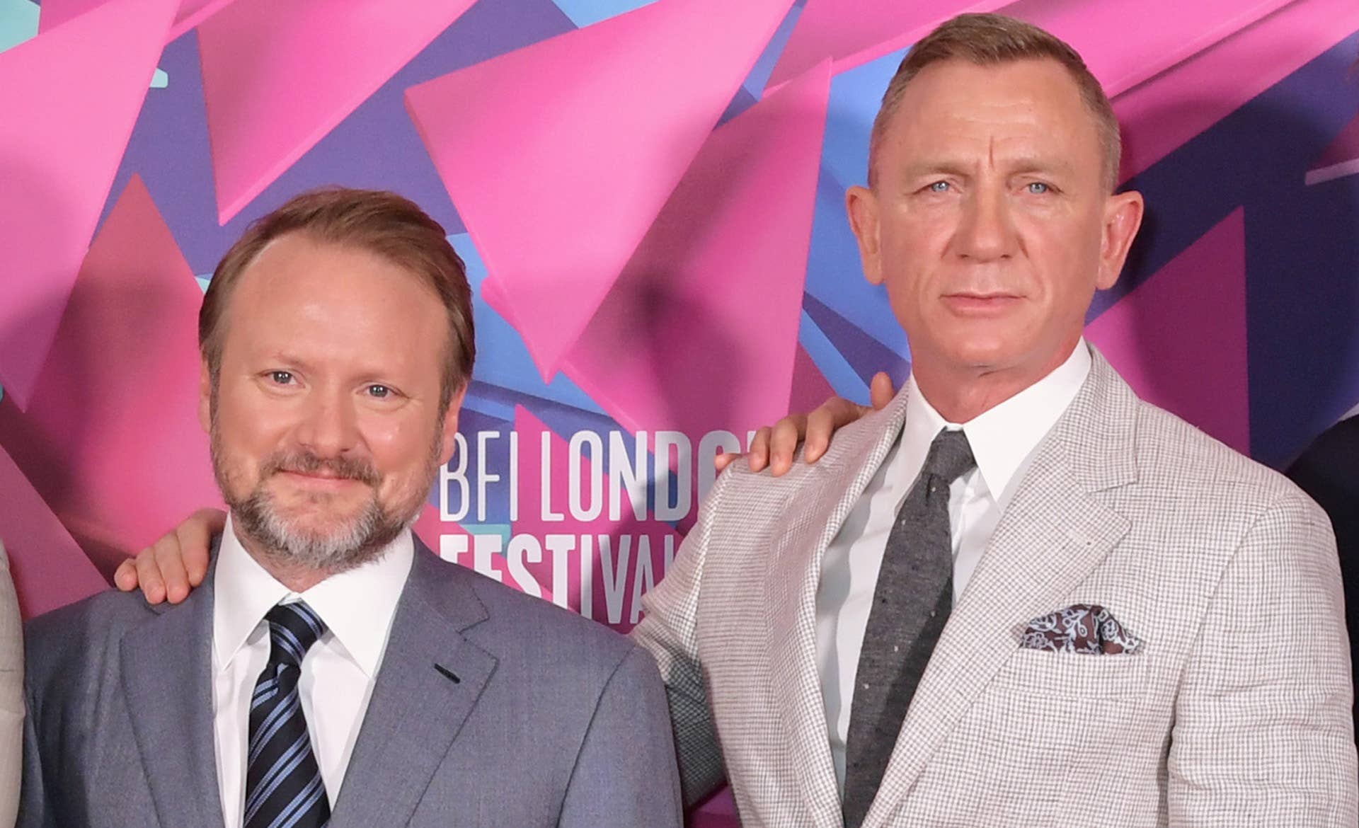 Rian Johnson and Daniel Craig on red carpet