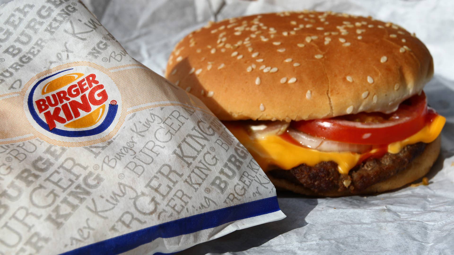 Whopper from the fast food chain Burger King sits on a packaging paper in Kaufbeuren, Germany.