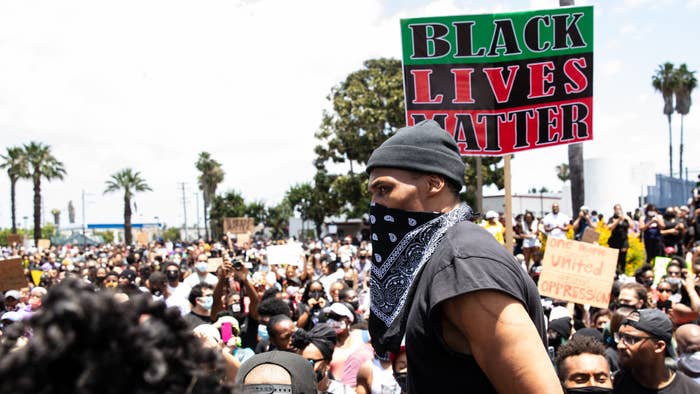 Russell Westbrook surveys Compton, CA crowd at Peace Ride and walk with the Compton Cowboys.