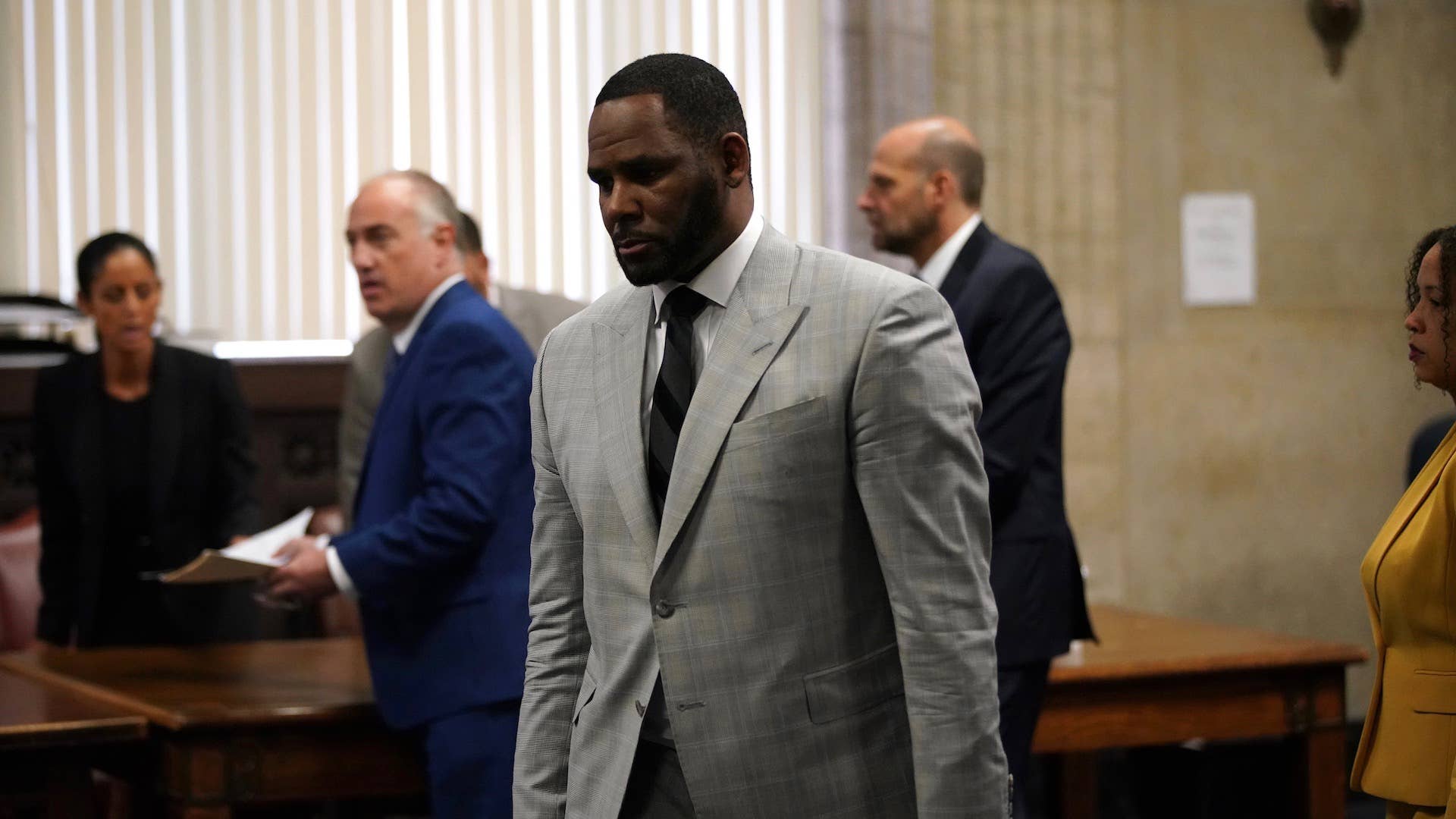 R. Kelly pleads not guilty to a new indictment at Leighton Criminal Court Building