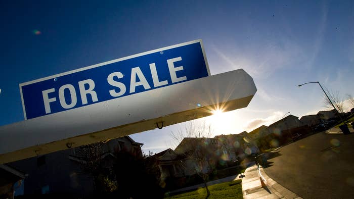 Image of a for sale sign at a home