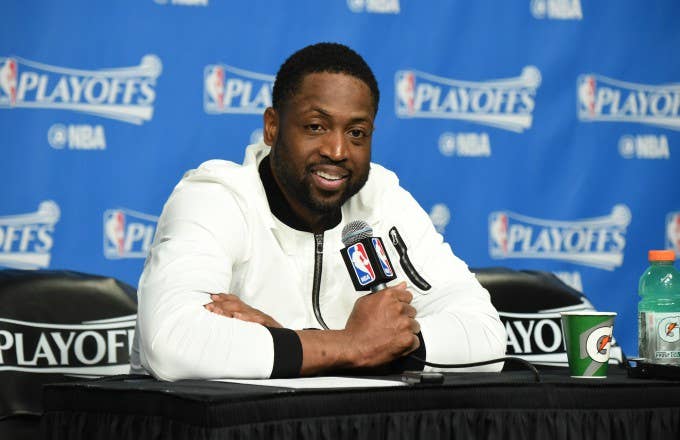 Dwyane Wade speaks with reporters after a playoff game.