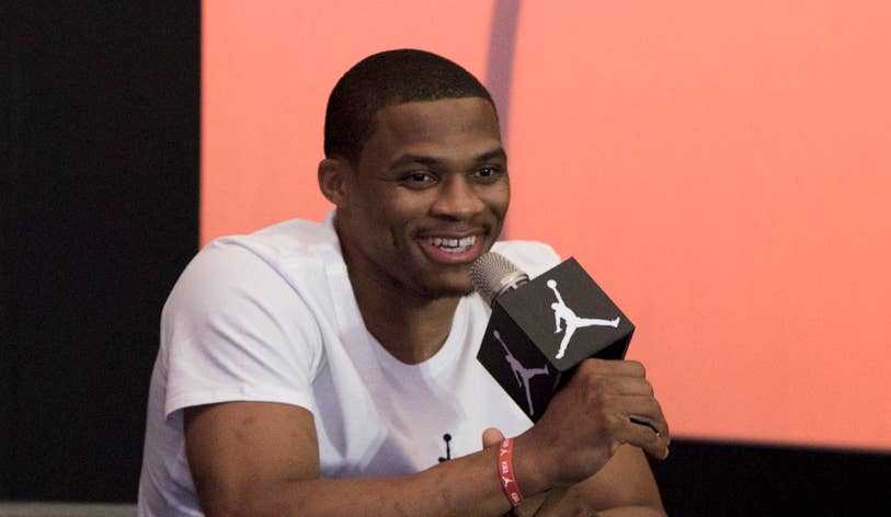 Russell Westbrook holding microphone