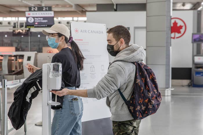 Travellers at Toronto&#x27;s Pearson airport during pandemic