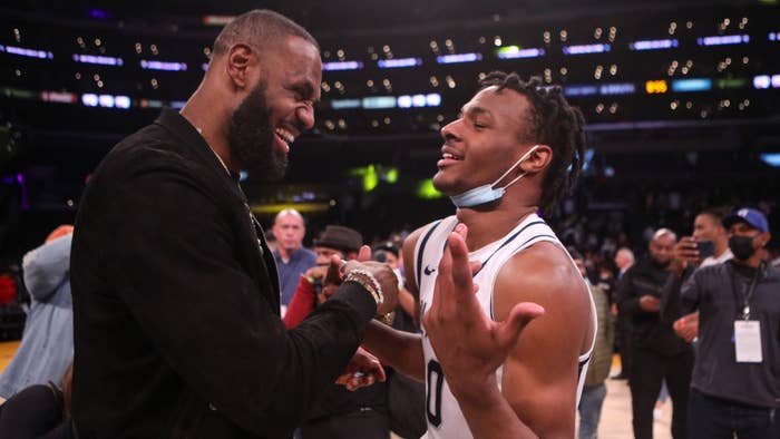 Lebron James comes onto the court to congratulate his son Bronny James.