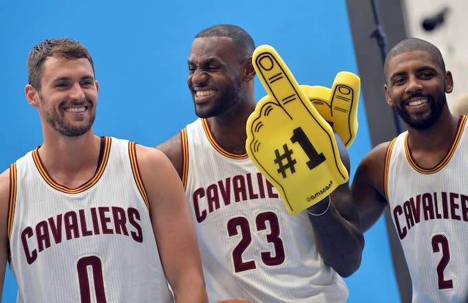 Kevin Love, Kyrie Irving, and LeBron James pose for photo together.
