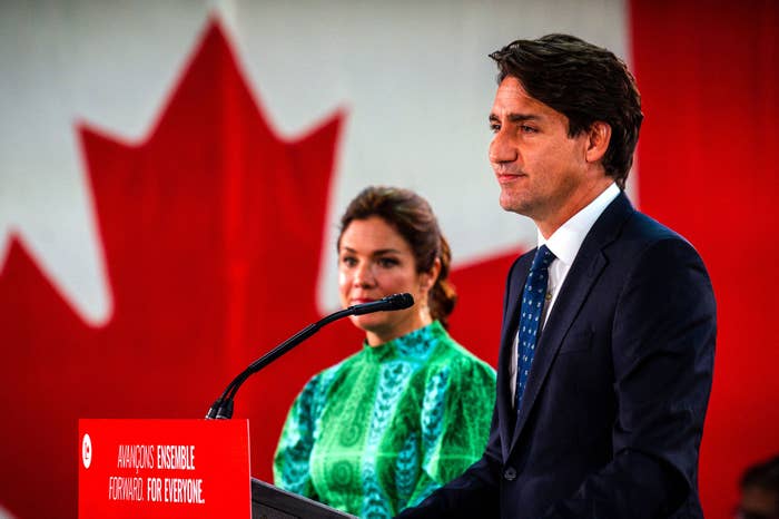Canadian Prime Minister Justin Trudeau, flanked by wife Sophie Gregoire-Trudea, delivers his victory speech after snap parliamentary elections at the Fairmount Queen Elizabeth Hotel in Montreal, Quebec, early on September 21, 2021.
