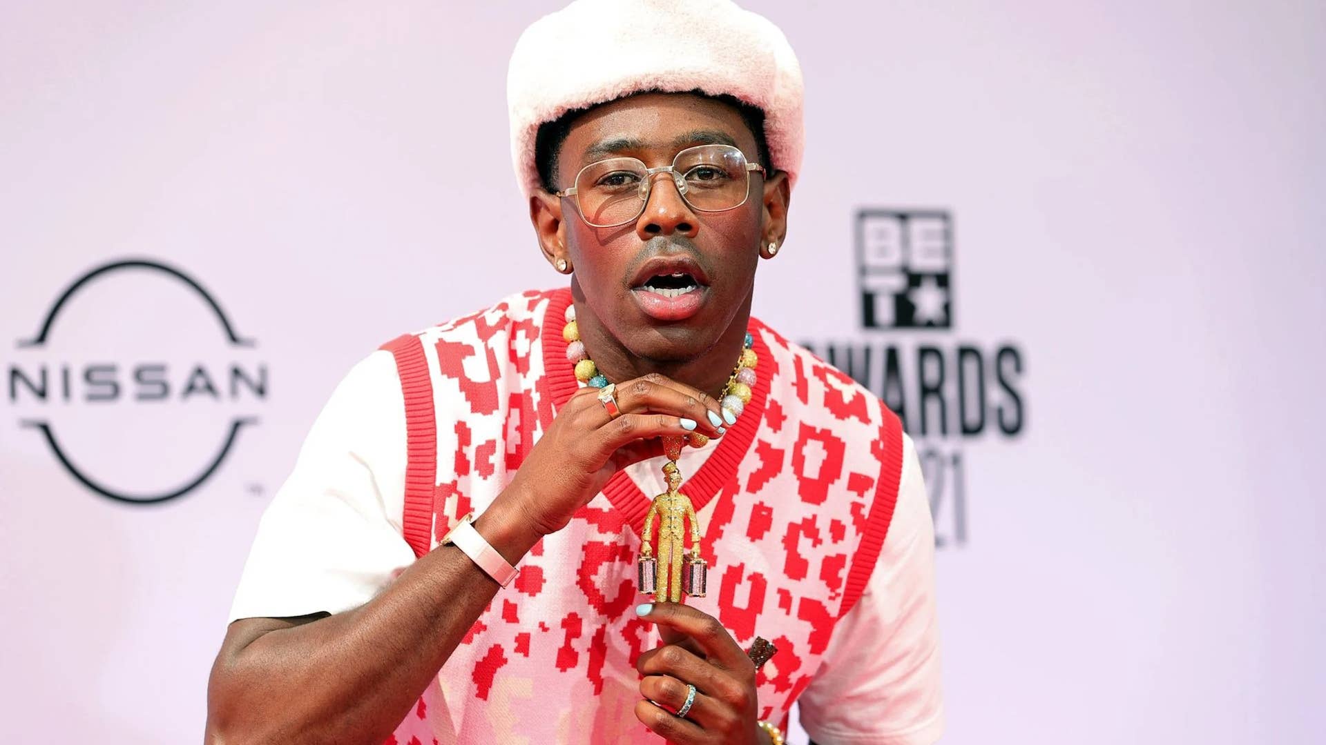 Tyler The Creator Holding Up Chain