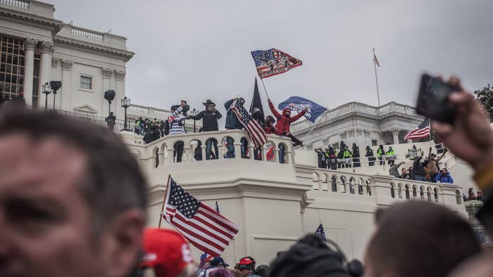 Trump insurrectionists cheer as more of the crowd gains access to the U.S. Capitol