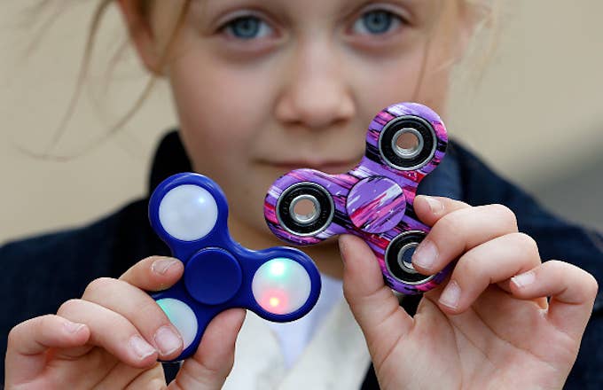 a child shows a &#x27;Hand Spinner&#x27; on May 20, 2017 in Paris, France.