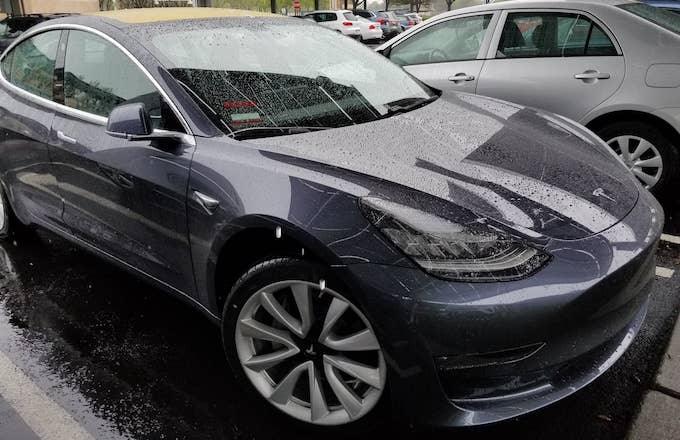 Close up of Tesla Model 3 electric car from Tesla Motors on a rainy day in Dublin, California.