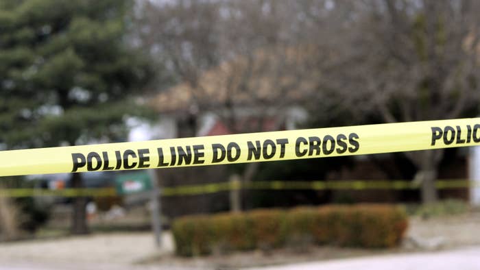 Police tape hangs across the street in front of the house that Dennis Rader lives.