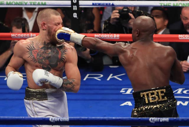 Conor McGregor getting punched in the face by Floyd Mayweather