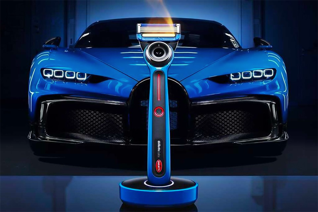 Gillette Bugatti edition heated razor in front of blue Bugatti.