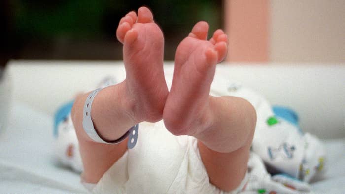 Photograph of a baby in a hospital nursery