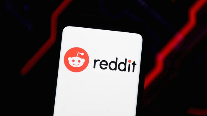 In this photo illustration a Reddit logo seen displayed on a smartphone.