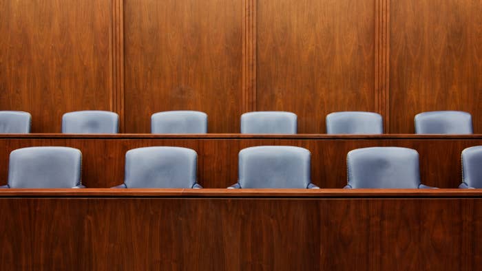 This photo shows jury chairs in a court room