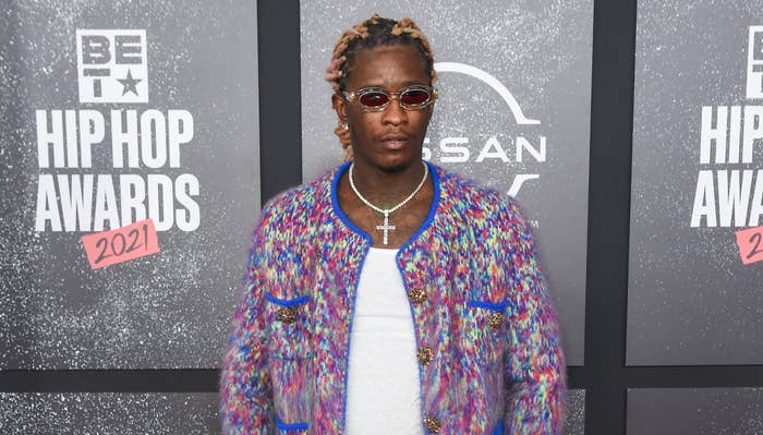 Young Thug on a red carpet staring