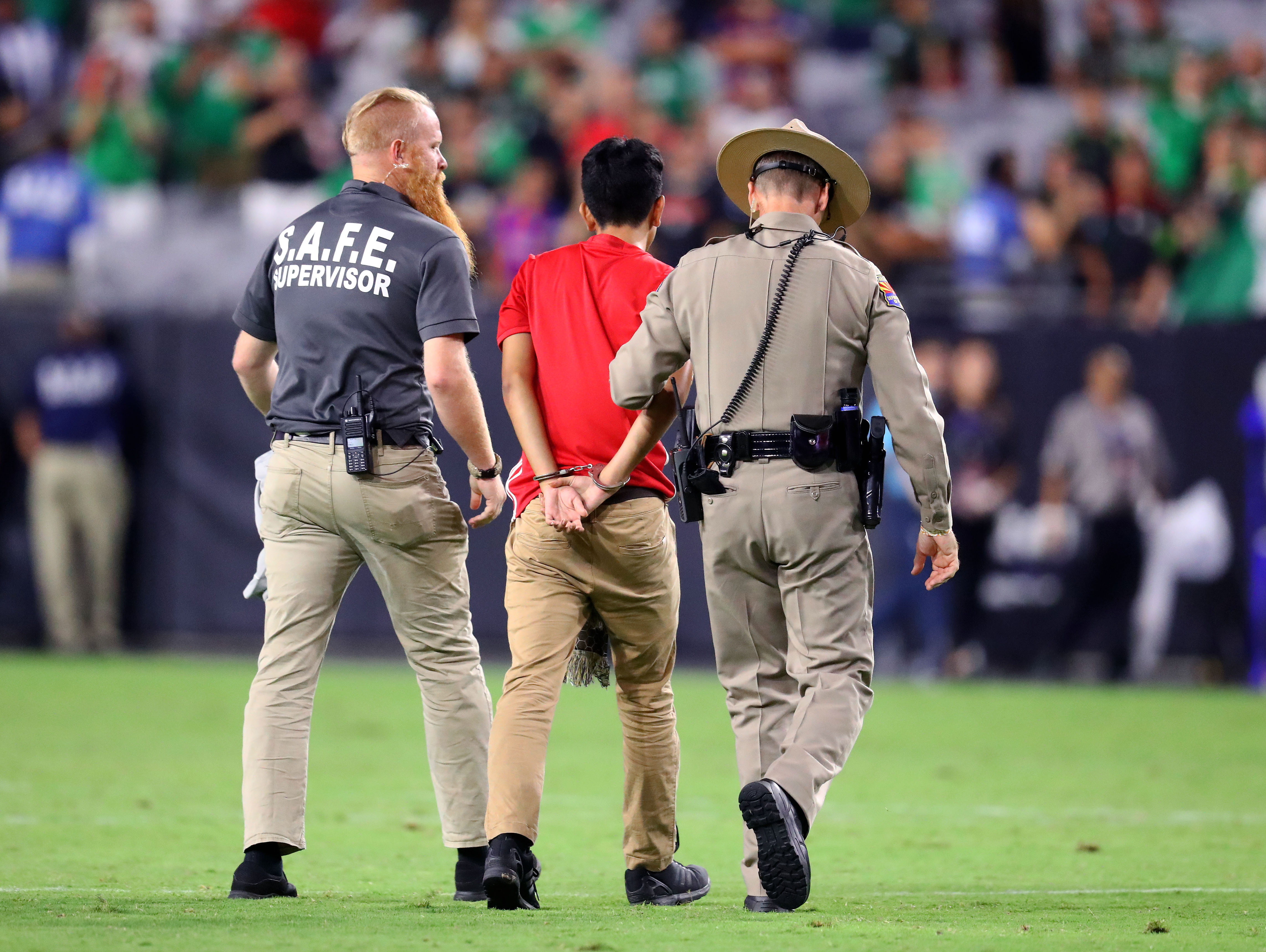 Super Bowl fan runs onto field during second half of game