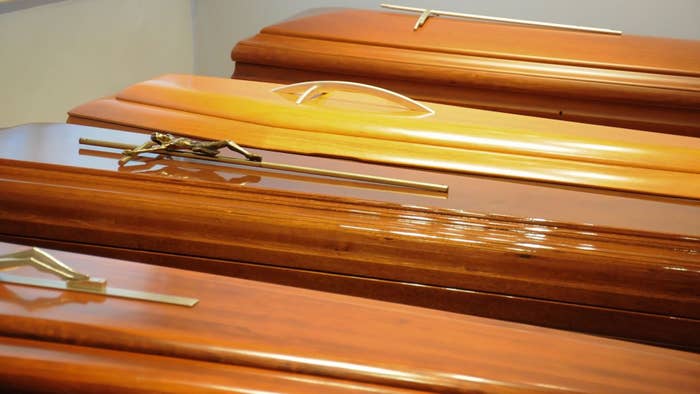 Close-up of the display of caskets for sale in a funeral home