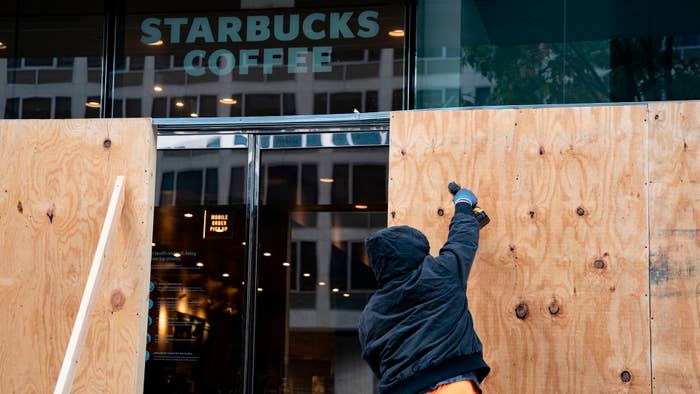 Wooden boards protect a Starbucks location near the White House