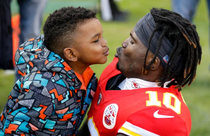 Tyreek Hill #10 of the Kansas City Chiefs teases his son