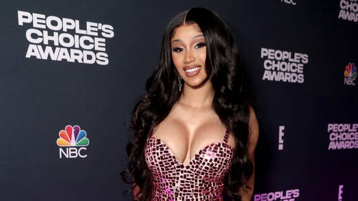 Cardi B poses for photo backstage at an awards show.