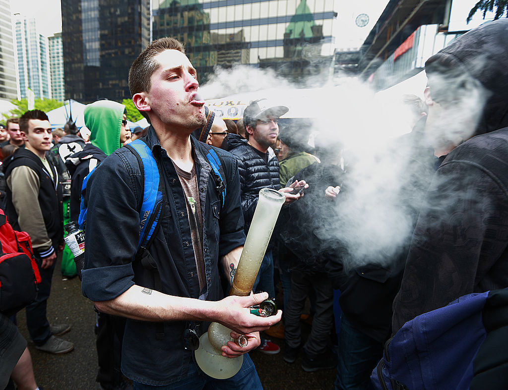 man smoking bong