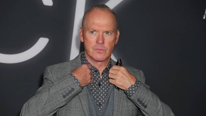 Michael Keaton poses for photographers at premiere event.